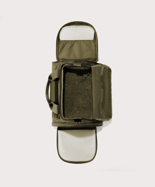 Dagne Dover Large Kyoto Pet Carrier in a deep olive green seen unzipped, top down view.