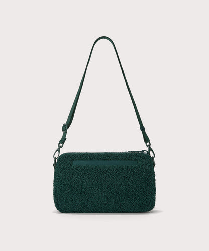 nora shoulder bag in a saturated, jewel-toned deep green with bold blue undertones. Back view. In a Faux Shearling a soft, wool-like plush made with recycled materials