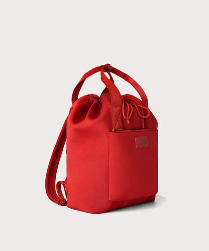 Dagne Dover Rhys Backpack in a fiery, saturated red leaning toward orange seen from an angle.
