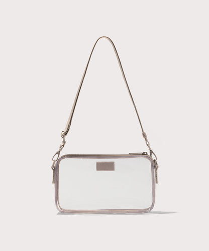 Clear crossbody bag with a beige strap on a white background. Stadium compliant.