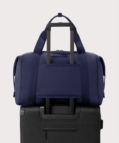 Extra large Landon Carryall in storm displaying luggage sleeve