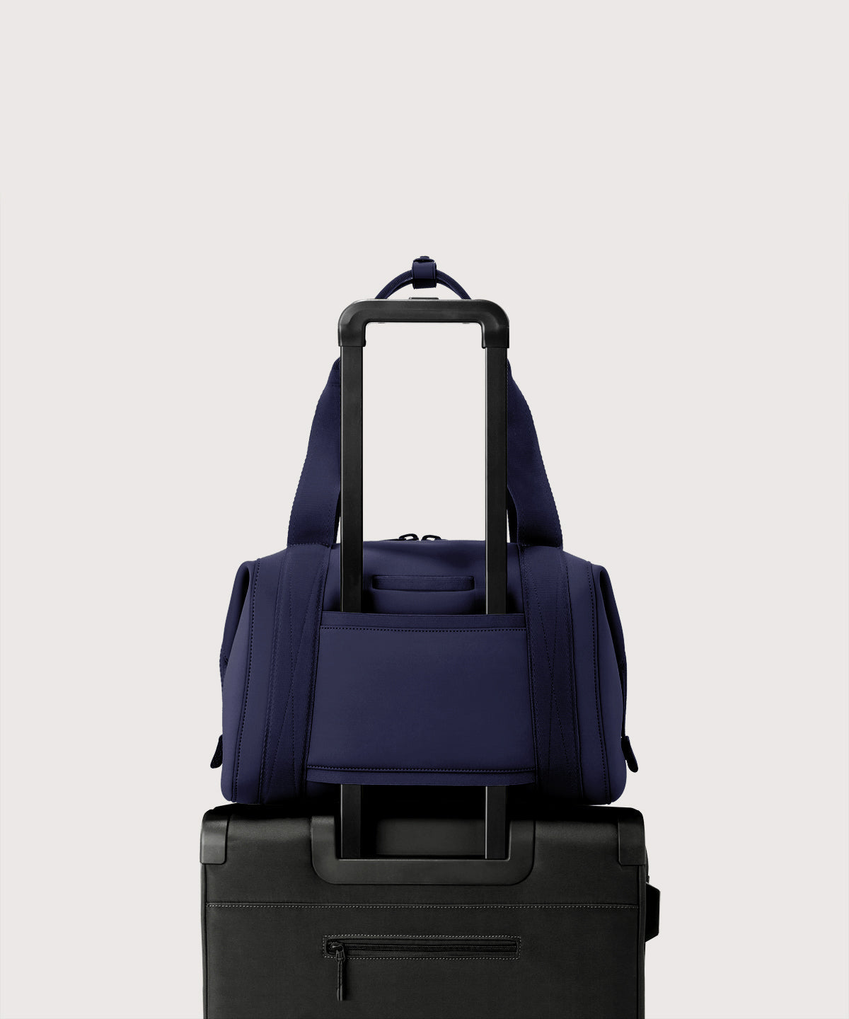 Large Landon Carryall in dark blue displaying luggage sleeve