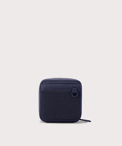 Dagne Dover small Arlo Tech Organizer in dark blue seen from the back.