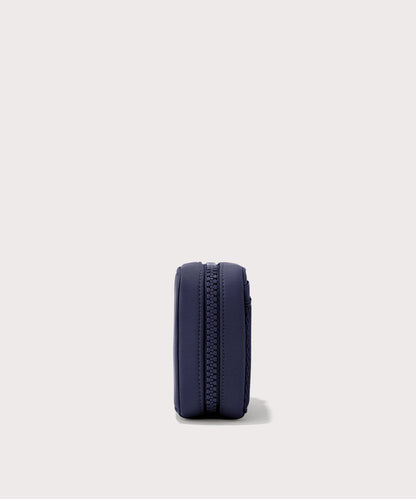 Dagne Dover small Arlo Tech Organizer in dark blue seen from the side.