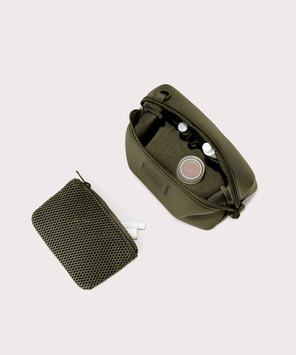 Dagne Dover Small Hunter Toiletry Bag in dark moss unzipped and seen from above with the removable air mesh pouch alongside it.