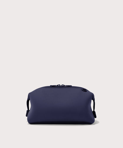 Dagne Dover Large Hunter Toiletry Bag in dark blue seen from the back.