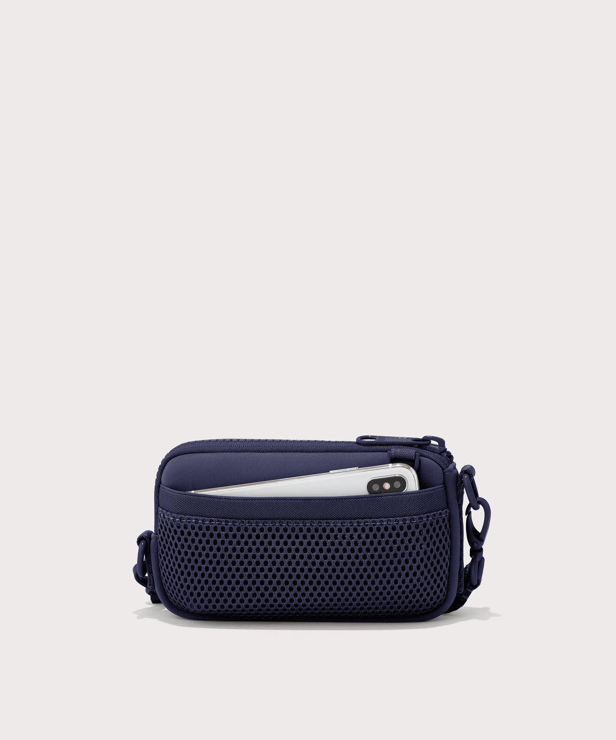 Dagne Dover Mara Phone Sling in dark blue showing the exterior air mesh slip.