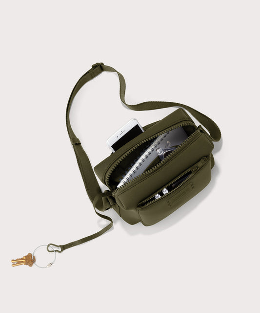 Dagne Dover Micah Crossbody in dark green seen from above, showing the interior air mesh pocket.