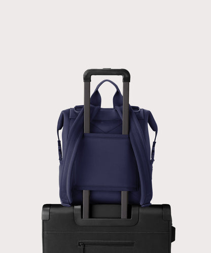 Dagne Dover medium Indi Diaper Backpack in dark blue showing the neoprene luggage sleeve.