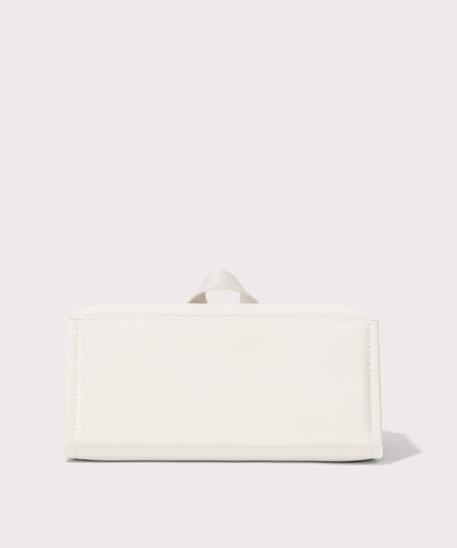 Dagne Dover Remi foldable glasses holder in white seen from the back.