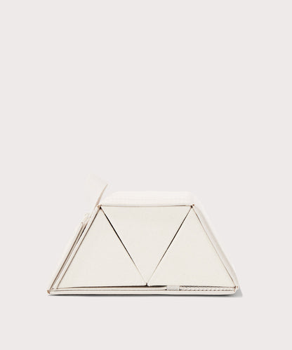 Dagne Dover Remi foldable glasses holder in white seen from the side.