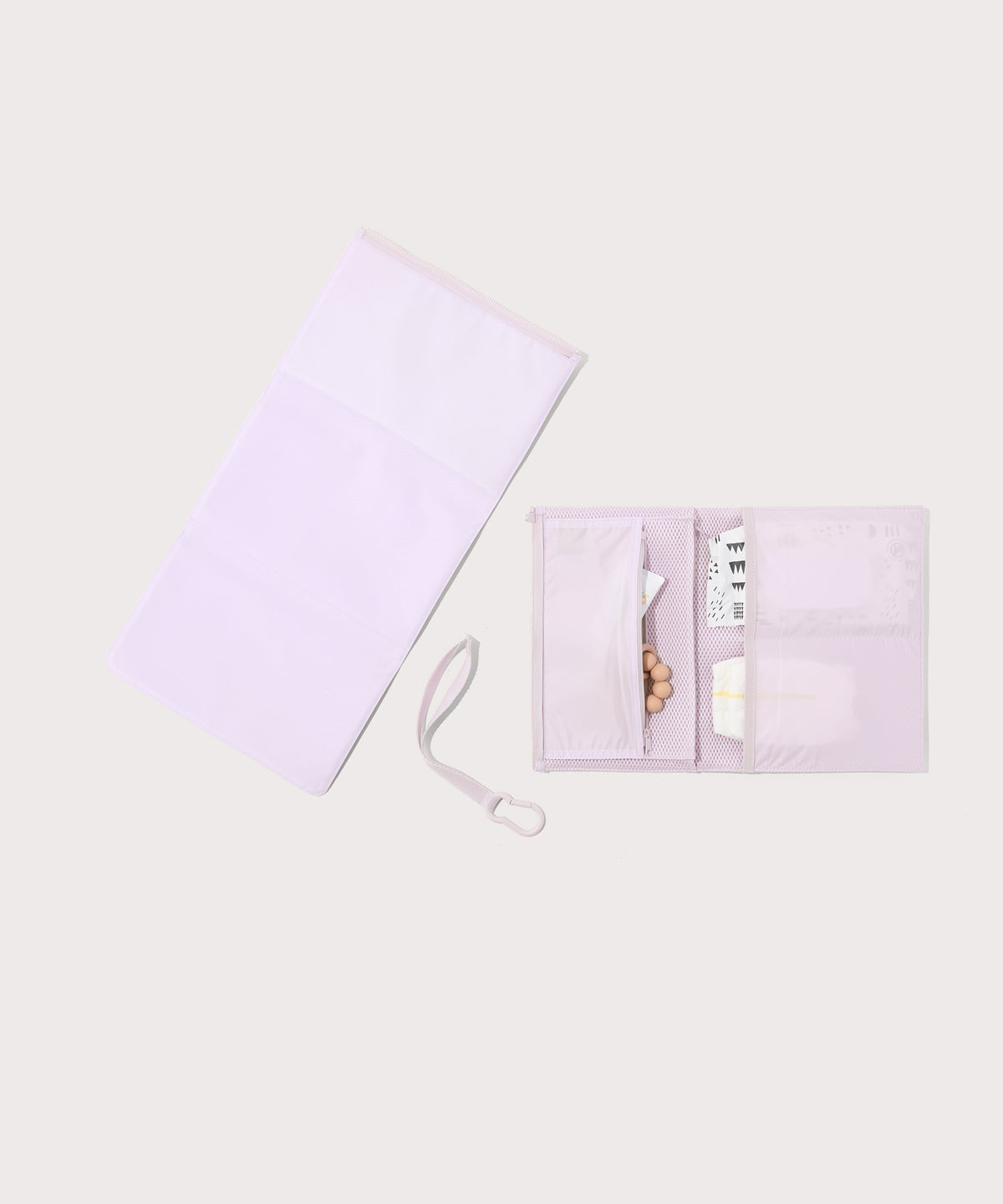 Dagne Dover Joey Changing Kit in a soft purple with grey undertones unfolded, revealing the detachable changing mat.