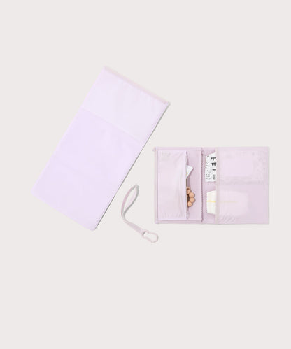 Dagne Dover Joey Changing Kit in a soft purple with grey undertones unfolded, revealing the detachable changing mat.