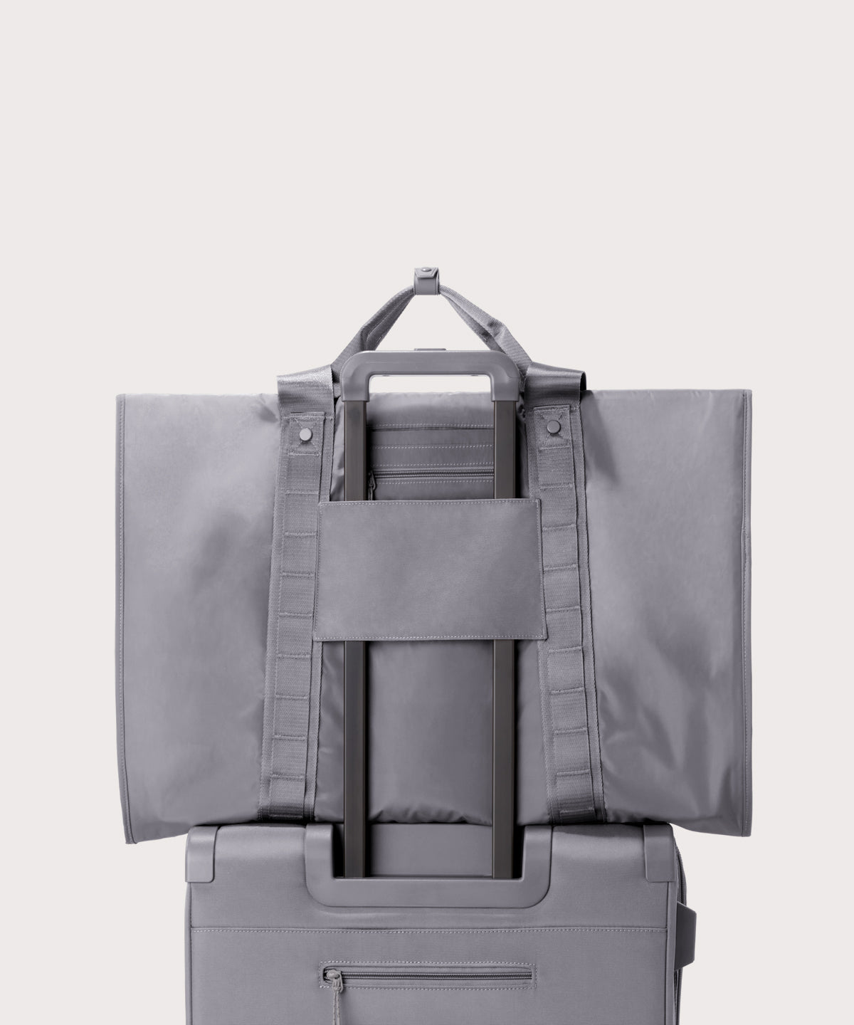 Back view of Capri garment bag in ash on luggage handle