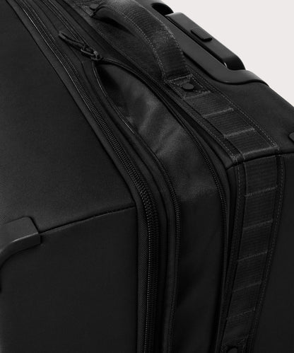 Detail shot of Sydney checked rolling luggage 25" in black expandable zipper feature